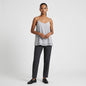 Model wearing Lynn's Closet Boutique Nouvelle 95Silk gray camisole with layered hem, spaghetti straps, and dark trousers