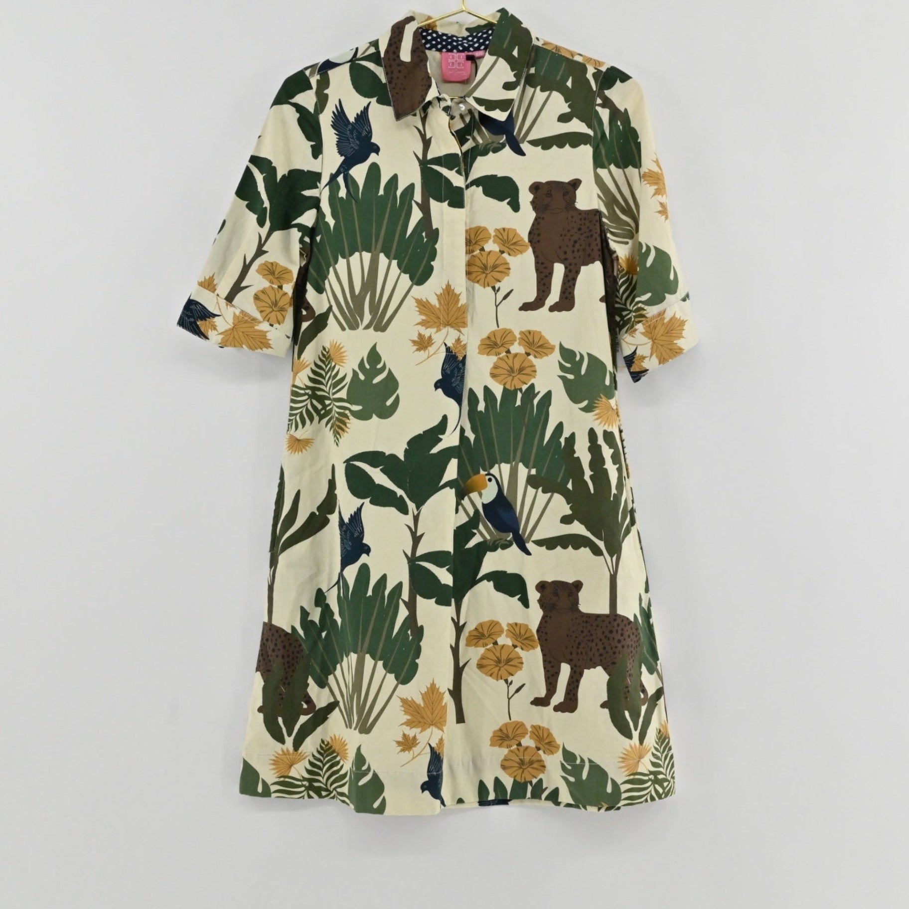 Lynn's Closet Boutique Just Darviny Oberoi shirt dress with a cream base featuring tropical animal and floral print.