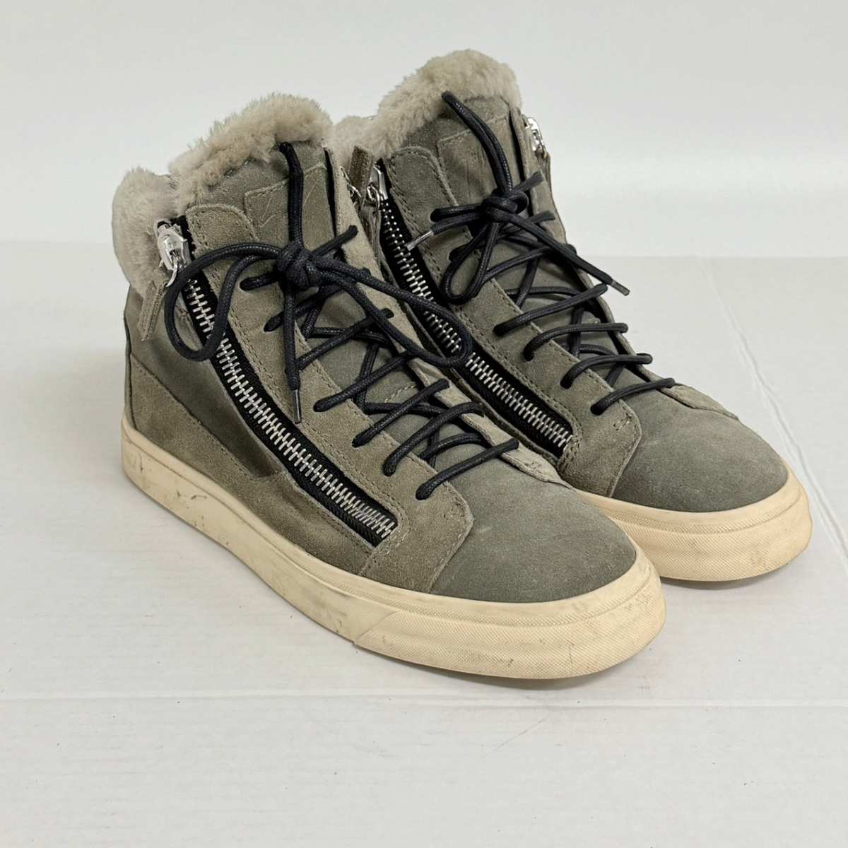 Lynn's Closet Boutique olive green suede high-top sneakers with fur lining, side zippers, and black laces.