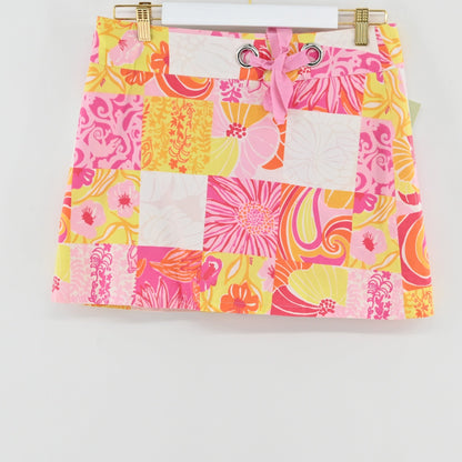 Lynn's Closet Boutique Lilly Pulitzer patchwork floral mini skort in pink and yellow with a tie-waist detail