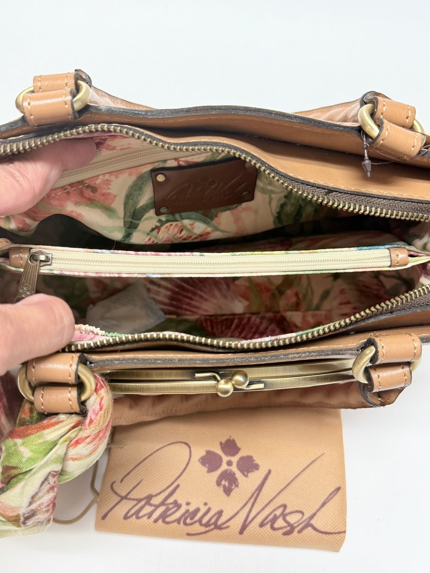 Lynn's Closet Boutique Patricia Nash Angela satchel interior with floral lining, zipper pocket, and leather logo patch.
