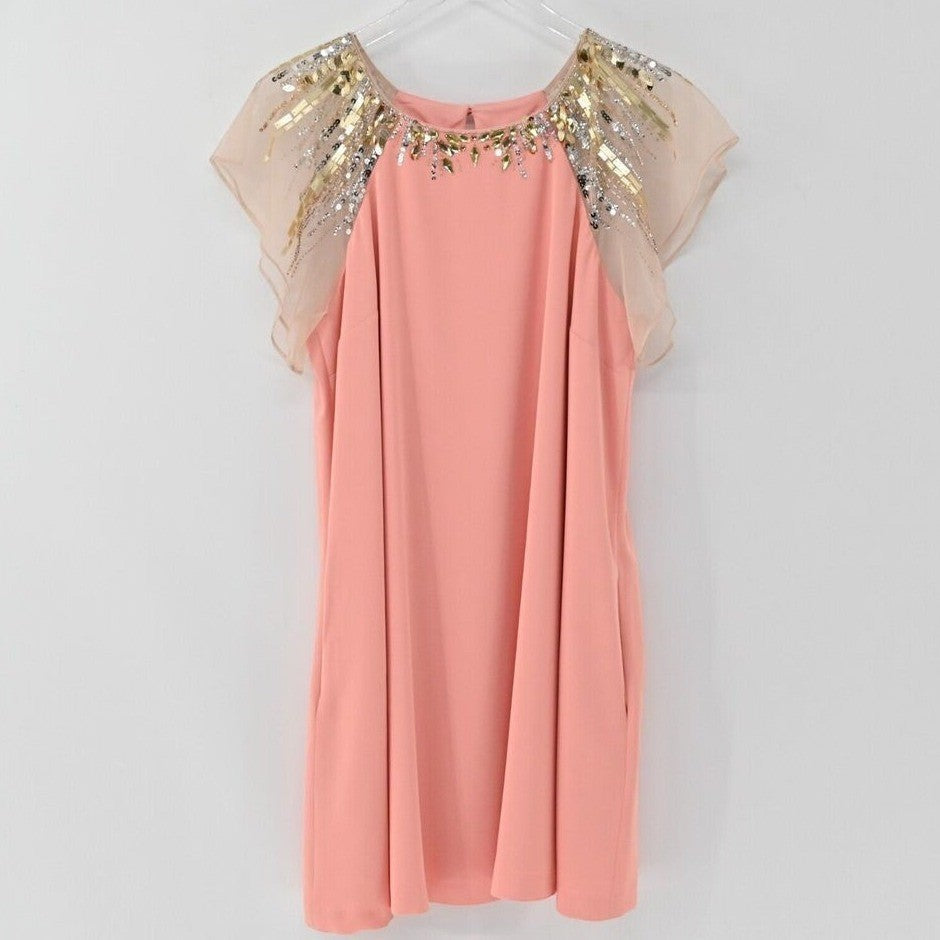 Lynn's Closet Boutique peach shift dress with metallic beaded flutter sleeves and sequin neckline detail.