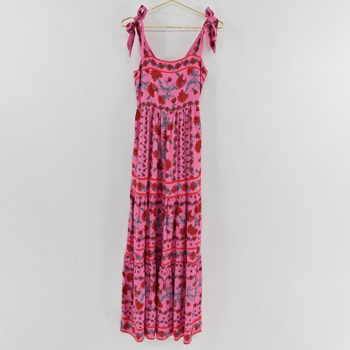 Lynn's Closet Boutique pink floral maxi dress with square neckline, tie-shoulder straps, and tiered skirt design.