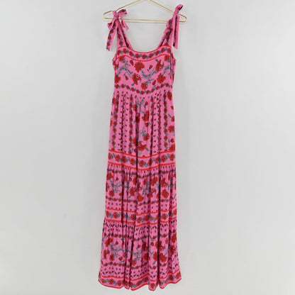 Lynn's Closet Boutique Beach Riot pink floral maxi dress with square neckline, tie straps, and tiered skirt.