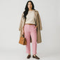 Model wearing Lynn's Closet Boutique Veronica Beard Kean pink high-rise tailored trousers with front seam detailing.