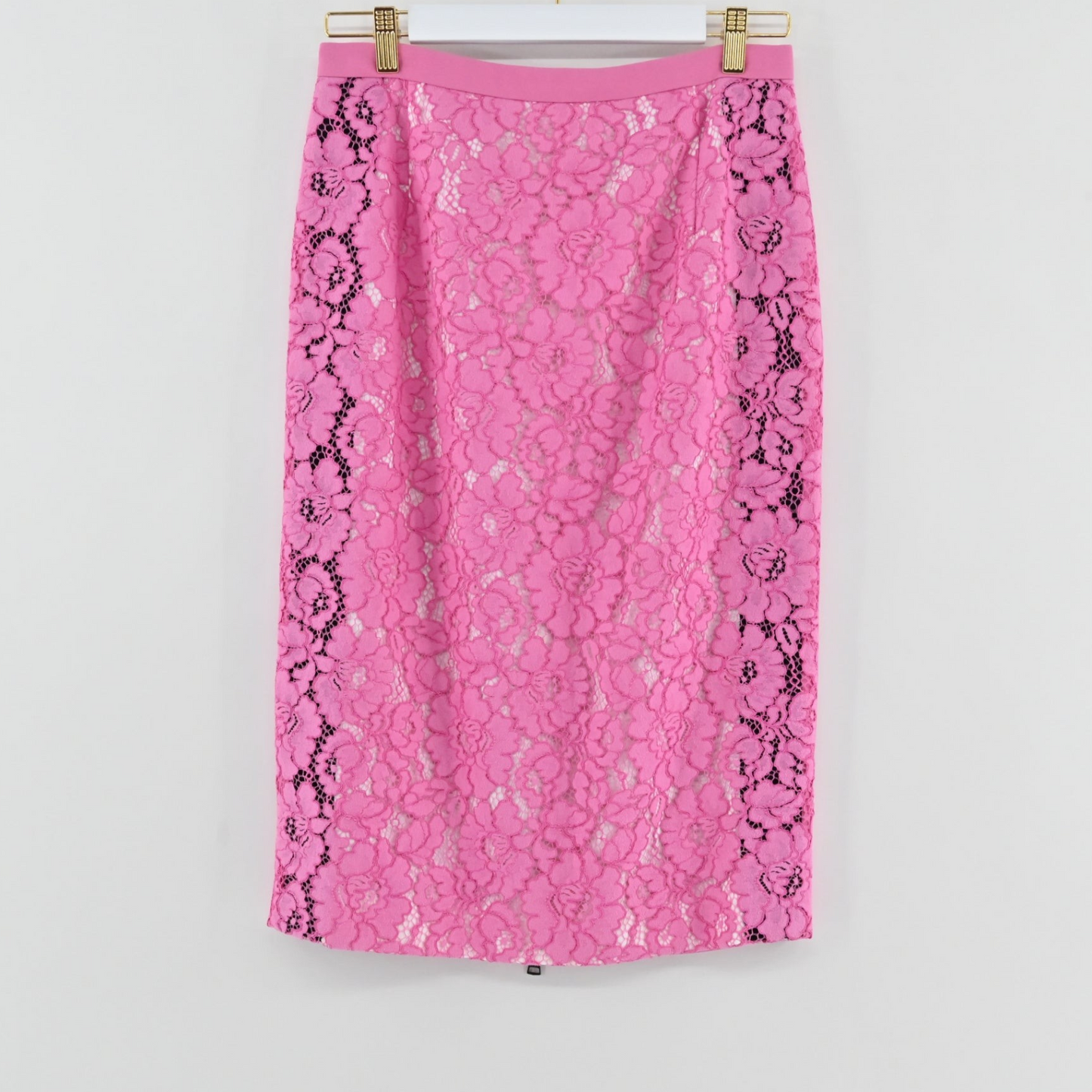 Lynn's Closet Boutique No21 pink lace pencil skirt with black side panel detailing hanging on a white background.