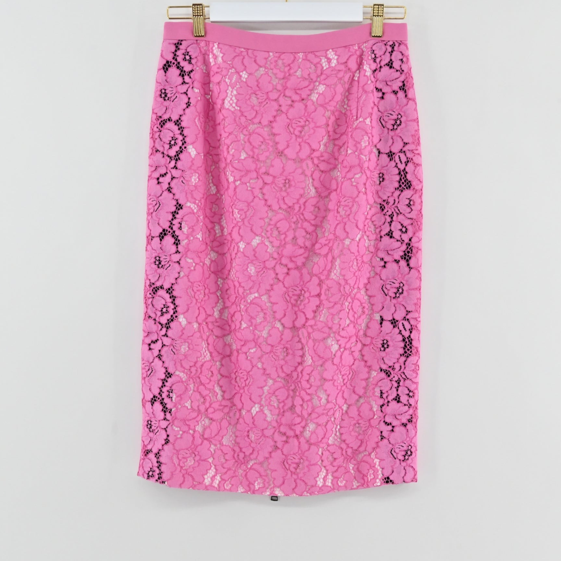 Lynn's Closet Boutique No21 pink lace pencil skirt with black side panel detailing hanging on a white background.