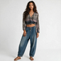 Model wearing Lynn's Closet Boutique Free People plaid wrap top with gradient wash, long sleeves, and cropped fit.