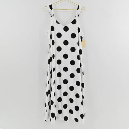Lynn's Closet Boutique Pomander Place white midi dress with black polka dots, V-neck, and sleeveless relaxed fit.