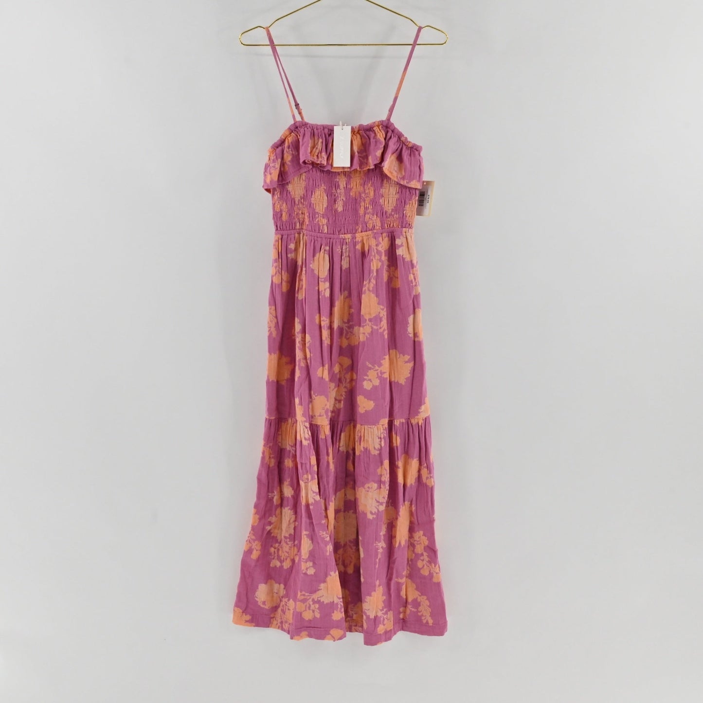 Lynn's Closet Boutique Z Supply purple midi dress with orange floral print, smocked bodice, and ruffled neckline.