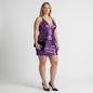 Model wearing a Lynn's Closet Boutique purple sequin mini dress with a plunging neckline and spaghetti straps