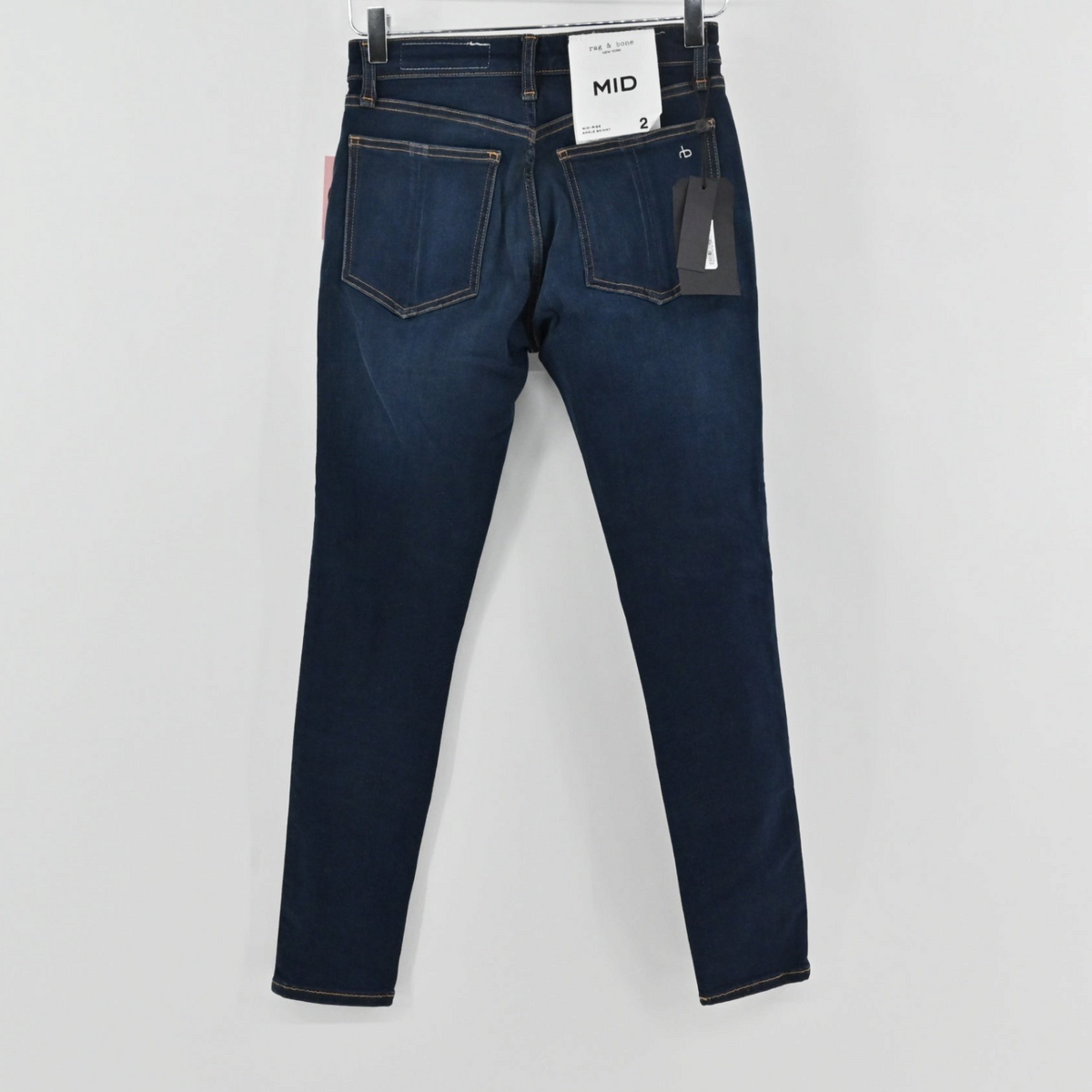 Lynn's Closet Boutique Rag & Bone Cate mid-rise dark wash denim jeans, back view with original tags attached.