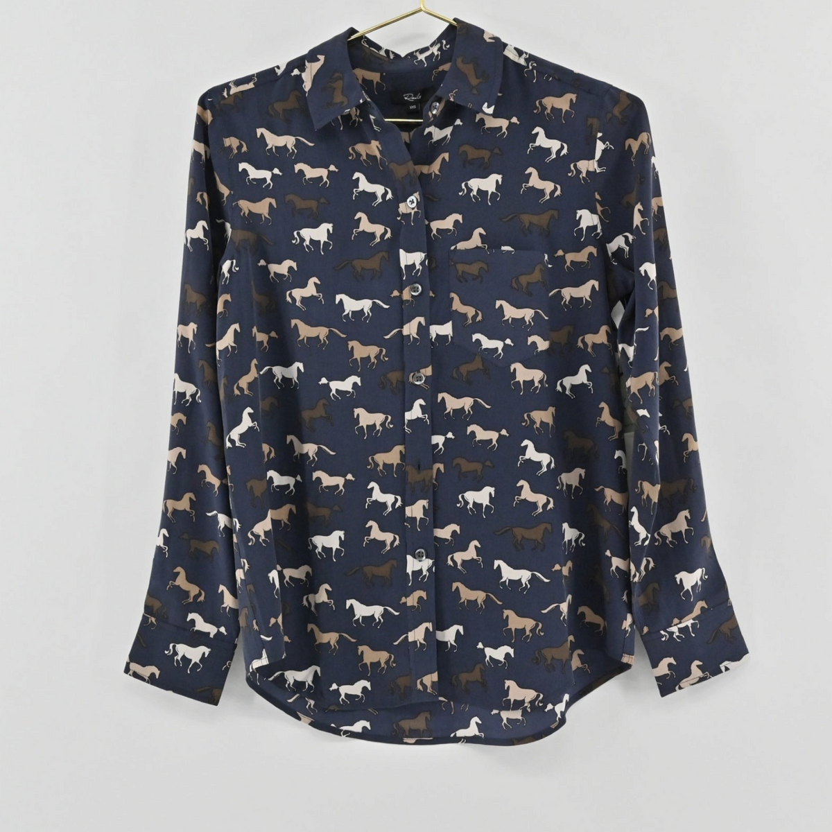 Lynn's Closet Boutique Rails Kate navy silk button-down shirt featuring a whimsical horse print and classic collar.