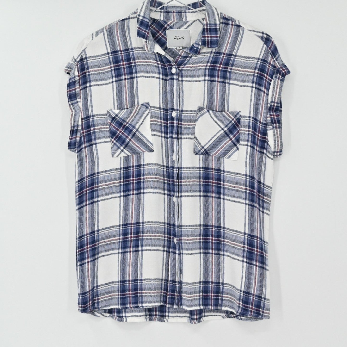 Lynn's Closet Boutique Rails Britt sleeveless plaid button-down shirt in white, navy, and red soft-touch fabric.