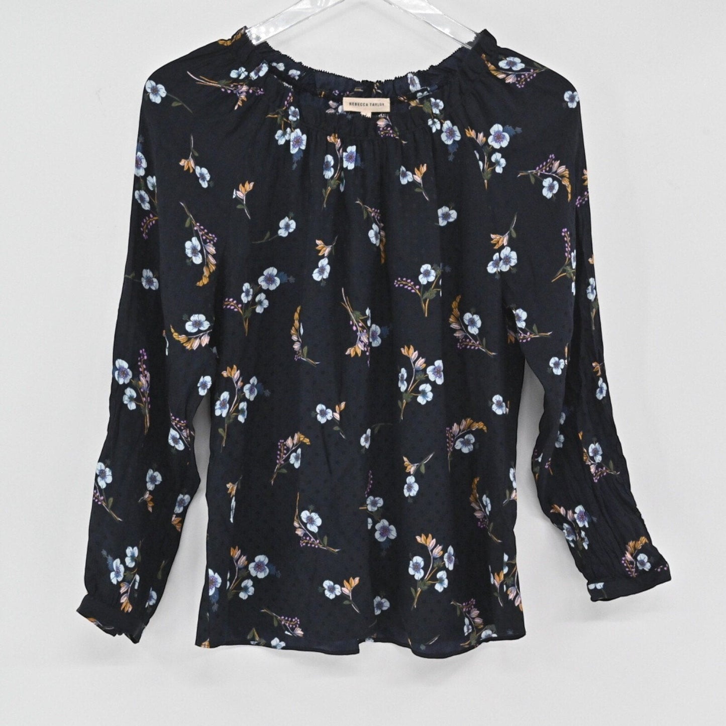 Lynn's Closet Boutique Rebecca Taylor black silk top with multi-colored floral print, gathered neck, and smocked cuffs.