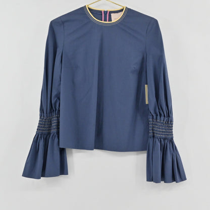 Lynn's Closet Boutique Roksanda blue cotton top with voluminous bell sleeves and smocked forearm detailing.
