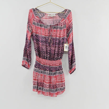 Lynn's Closet Boutique Rory Beca long sleeve bohemian dress in pink, red, and purple with a tie-front neckline.