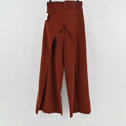 Lynn's Closet Boutique rust-brown wide-leg trousers with unique front-slit detailing hanging on a hanger