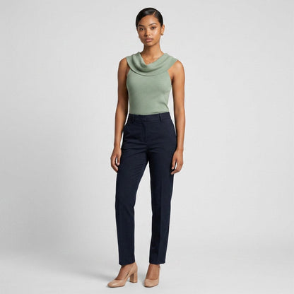 Lynn's Closet Boutique Alice + Olivia sage green sleeveless ribbed top with a cowl neckline worn by a model