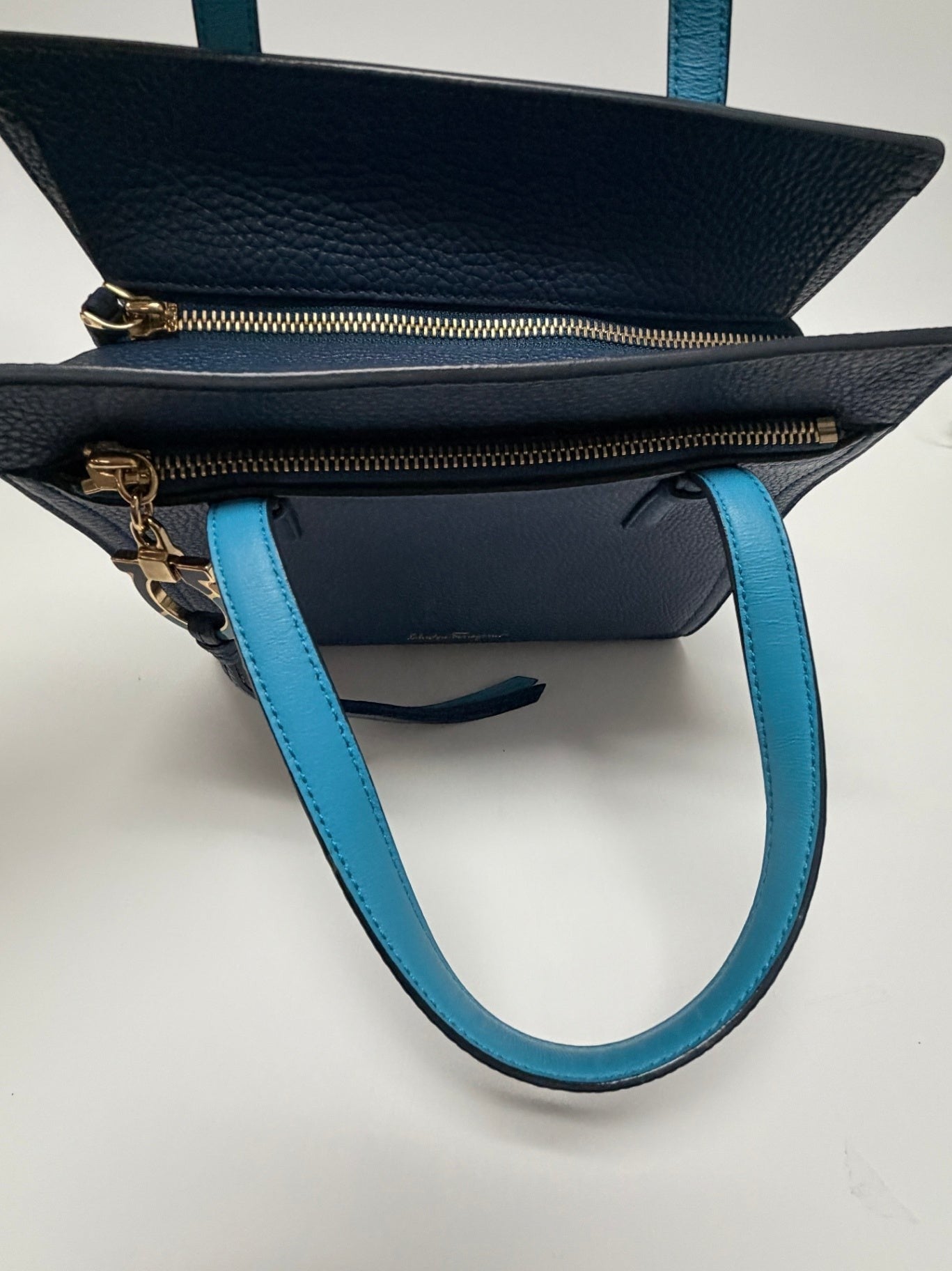 Lynn's Closet Boutique Salvatore Ferragamo Amy small blue pebbled leather tote bag with top zip and contrast handles