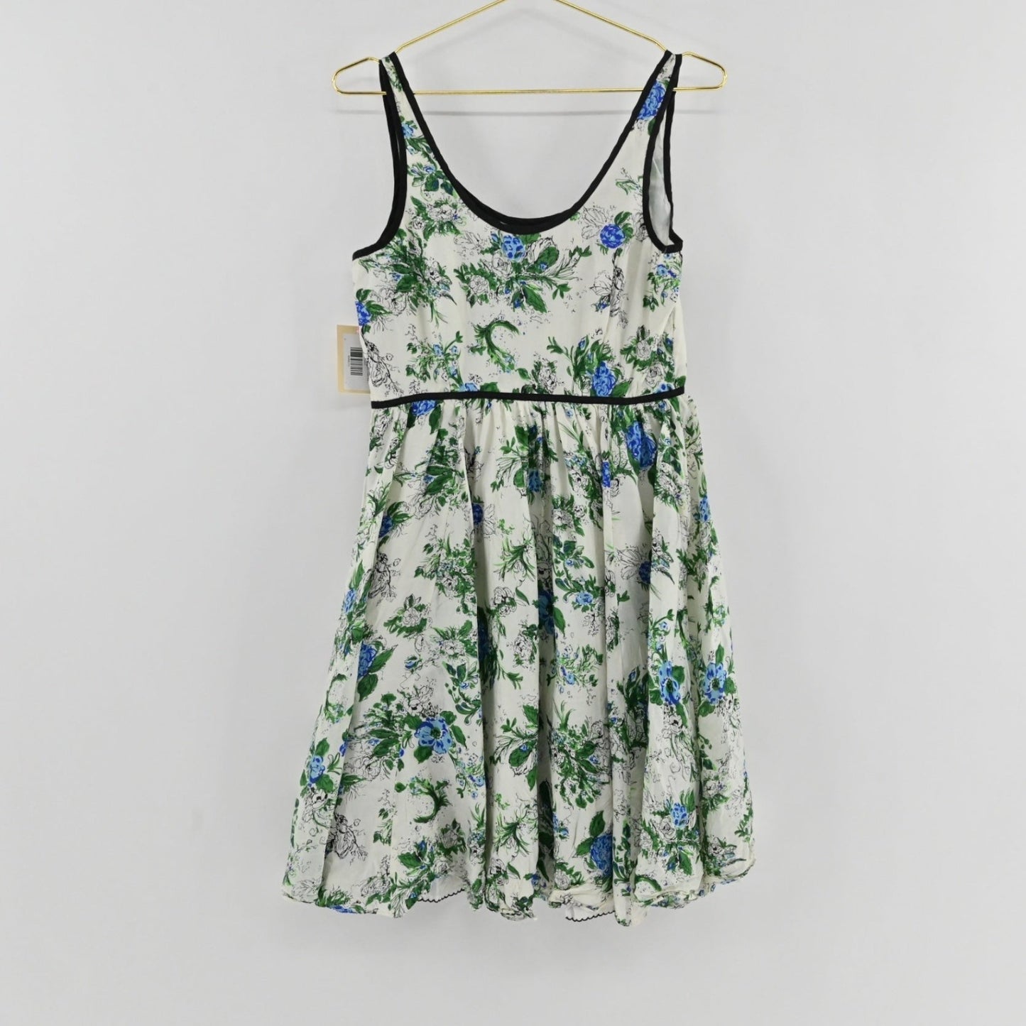Lynn's Closet Boutique Anthropologie silk floral dress with blue and green botanical print and black trim detailing.