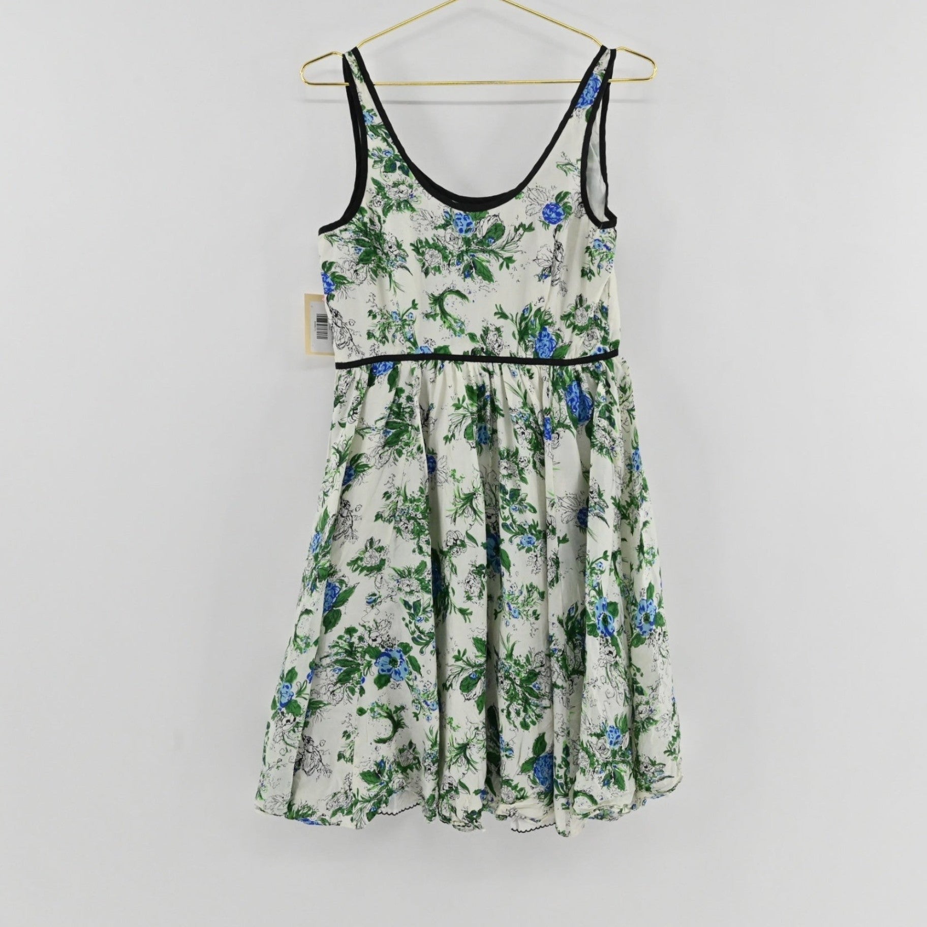 Lynn's Closet Boutique Anthropologie silk floral dress with blue and green botanical print and black trim detailing.