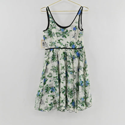 Lynn's Closet Boutique Anthropologie silk floral dress with blue and green botanical print and black trim detailing.