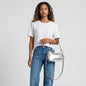 Lynn's Closet Boutique model wearing a white t-shirt and jeans holding a silver crinkle metallic Kate Spade bag