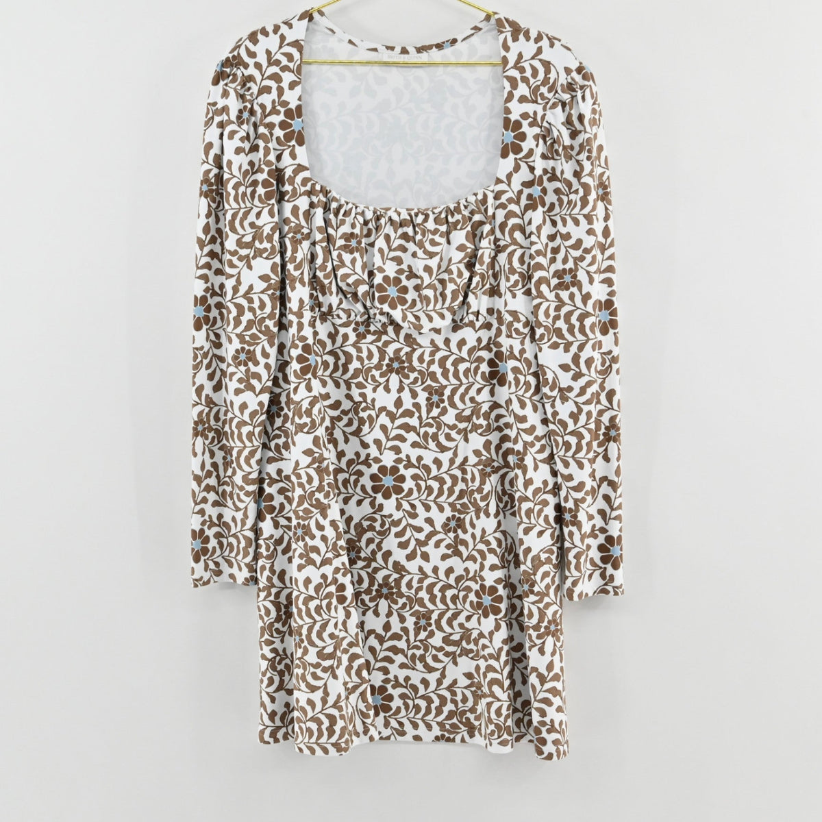 Lynn's Closet Boutique Smith Quinn white floral dress with brown botanical print, square neckline, and long sleeves.
