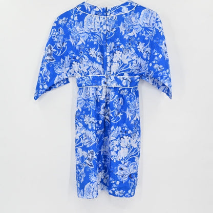 Lynn's Closet Boutique Socapri blue and white floral silk dress with white piping detail, back view.