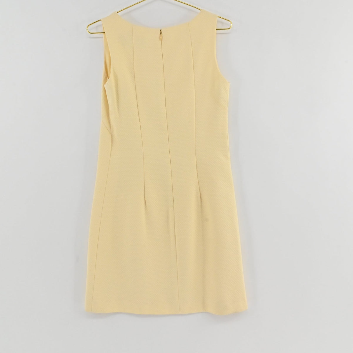 Lynn's Closet Boutique Steven Stolman butter yellow sleeveless shift dress with a boat neckline and textured fabric.