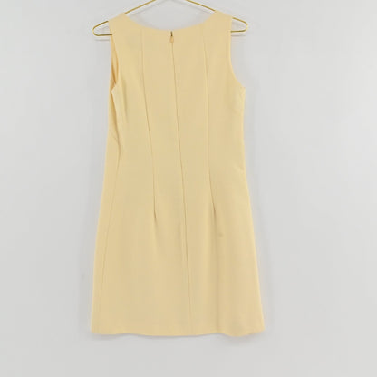 Lynn's Closet Boutique Steven Stolman butter yellow sleeveless shift dress with a boat neckline and textured fabric.