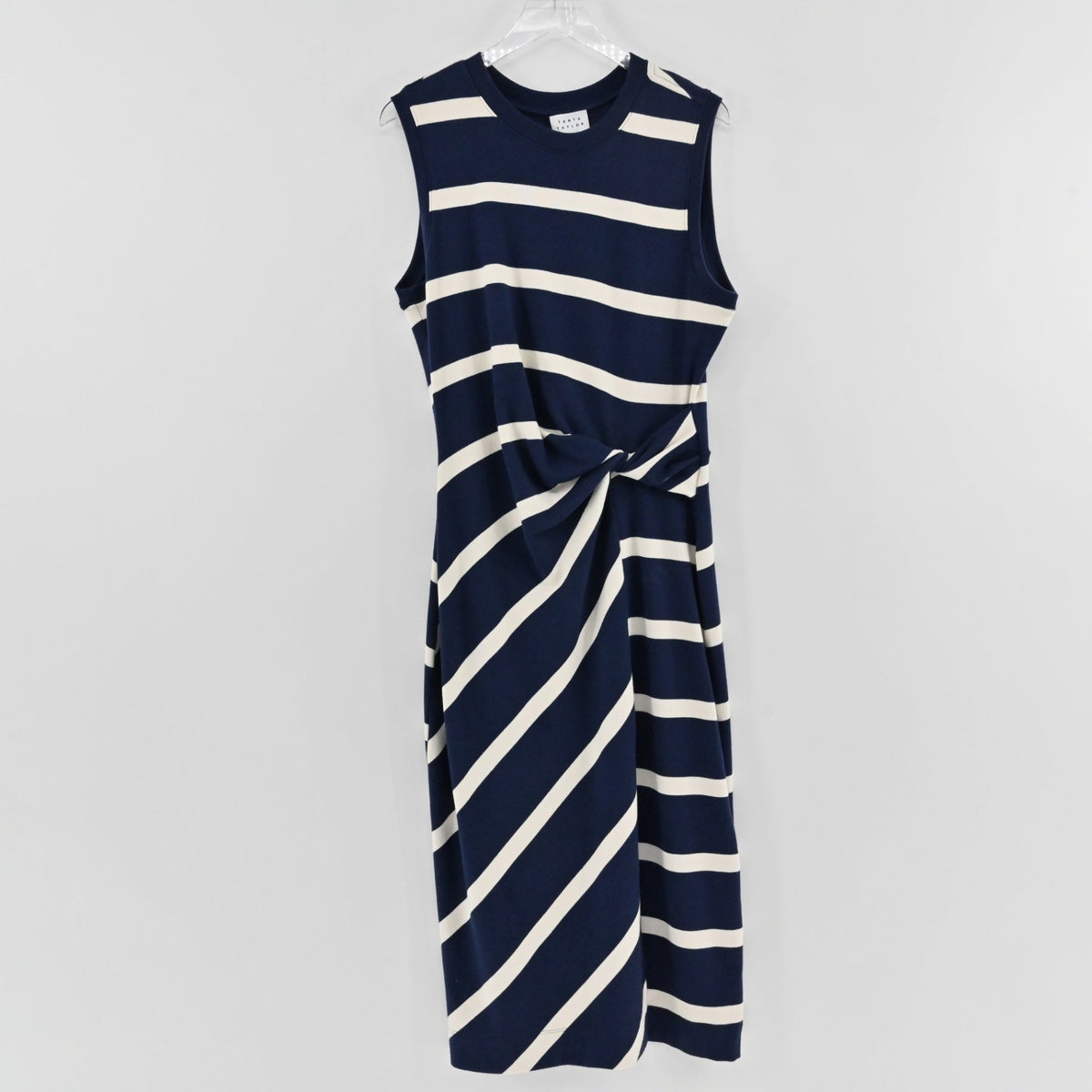 Lynn's Closet Boutique Tanya Taylor navy and cream striped sleeveless midi dress with a front twist waist detail.