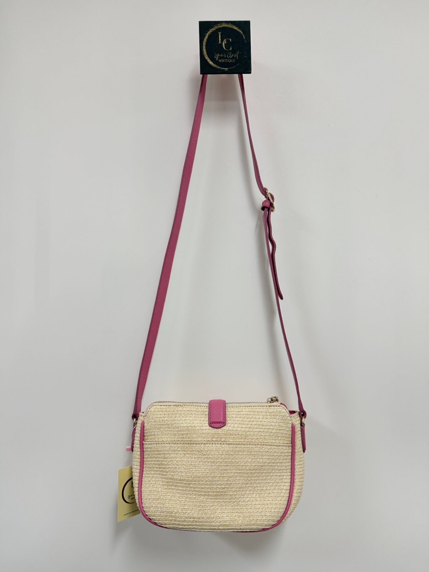Lynn's Closet Boutique Talbots raffia crossbody bag with vibrant pink trim, adjustable strap, and zip-top closure.