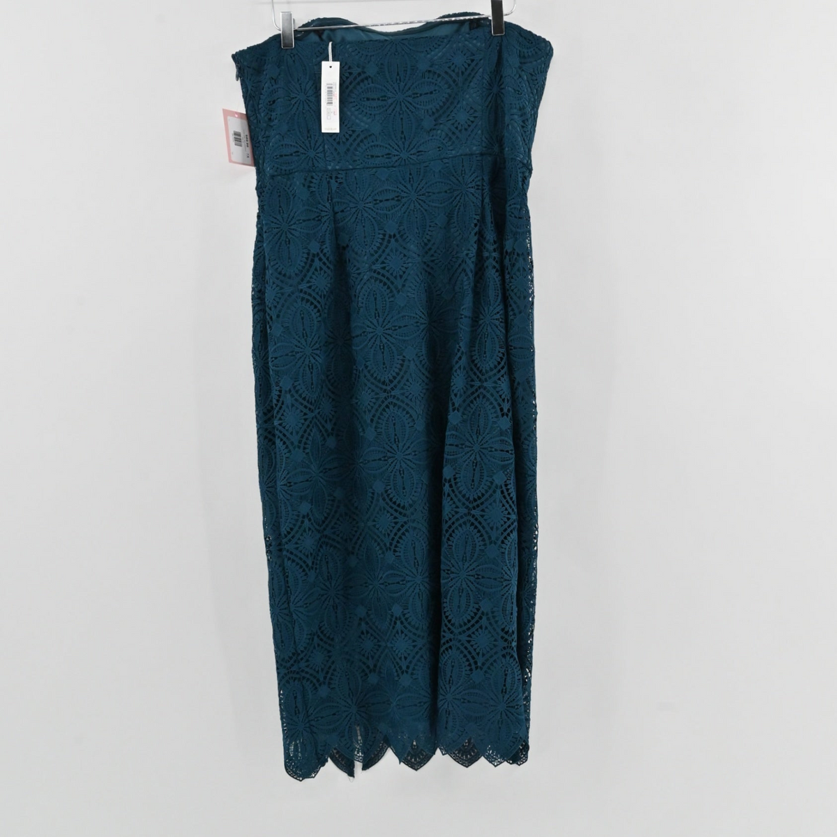 Lynn's Closet Boutique Trina Turk teal lace midi dress with a strapless bandeau bodice and scalloped hem detail.