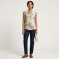 Model wearing a Lynn's Closet Boutique Ted Baker sleeveless floral top with bird print and bow detail, paired with jeans