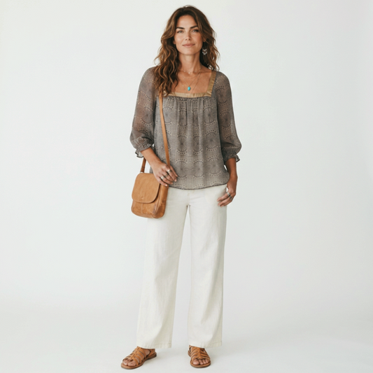 Model wearing a Lynn's Closet Boutique Ted Baker silk top with geometric fan print, square neckline, and 3/4 sleeves.