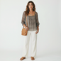 Model wearing a Lynn's Closet Boutique Ted Baker silk top with geometric fan print, square neckline, and 3/4 sleeves.