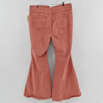 Lynn's Closet Boutique Free People terra cotta wide-leg flare pants with back pockets, shown from the back view.