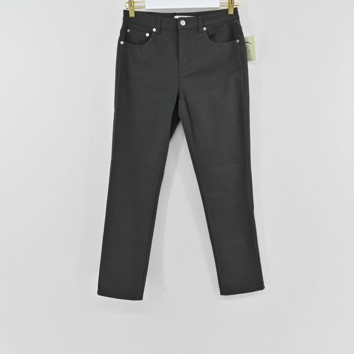 Lynn's Closet Boutique Thakoon slate grey cropped jeans with five-pocket styling hanging on a gold hanger.