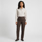 Lynn's Closet Boutique Theory tan and white vertical striped button-down shirt worn by a model with brown trousers
