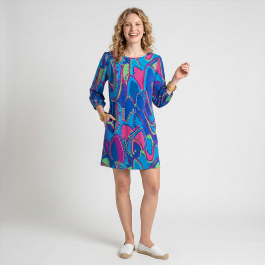 Lynn's Closet Boutique Tibi NY neon paisley print shift dress with three-quarter sleeves worn by a smiling model