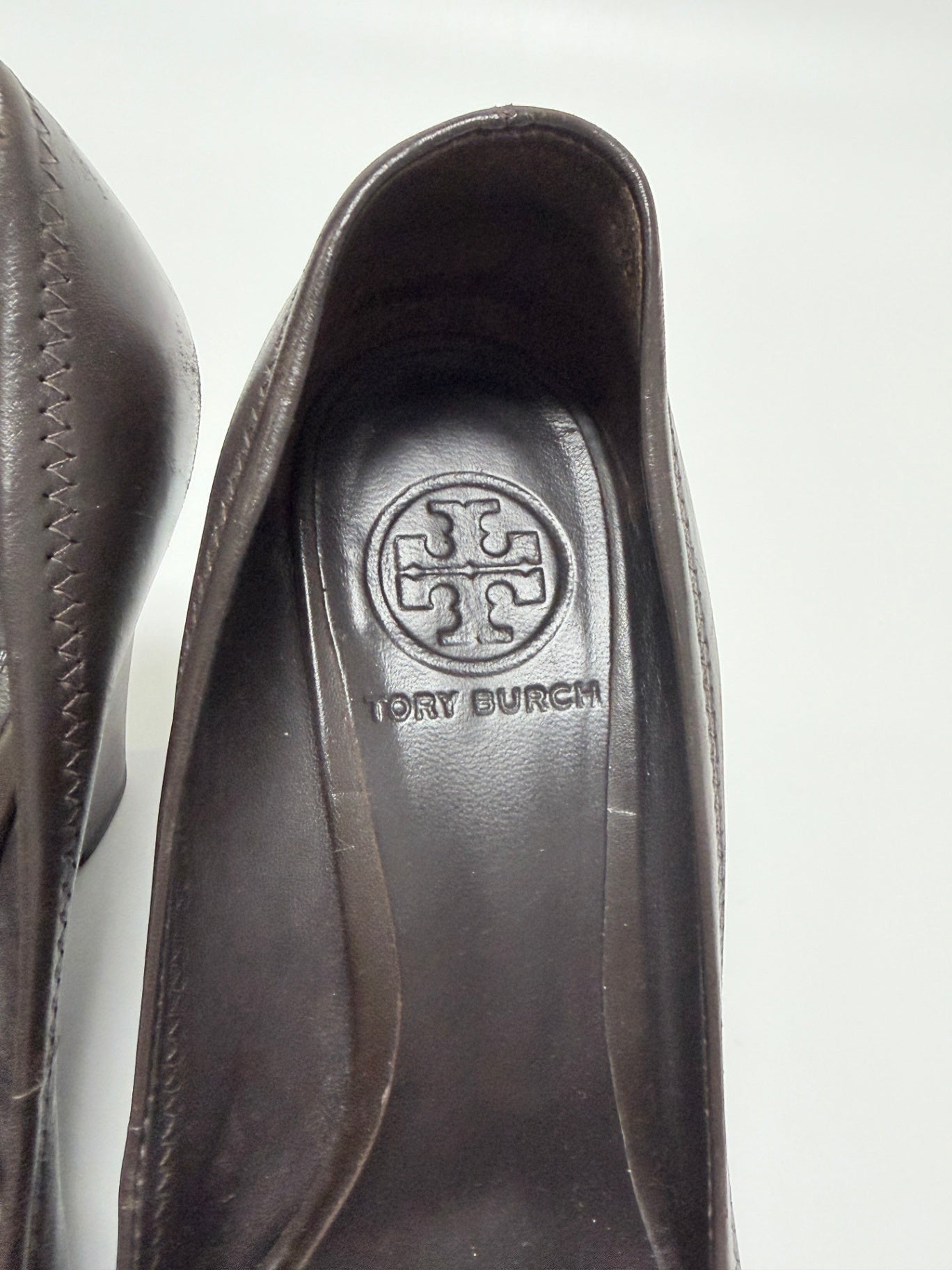 Lynn's Closet Boutique brown leather Tory Burch wedge shoes with embossed logo on the insole.