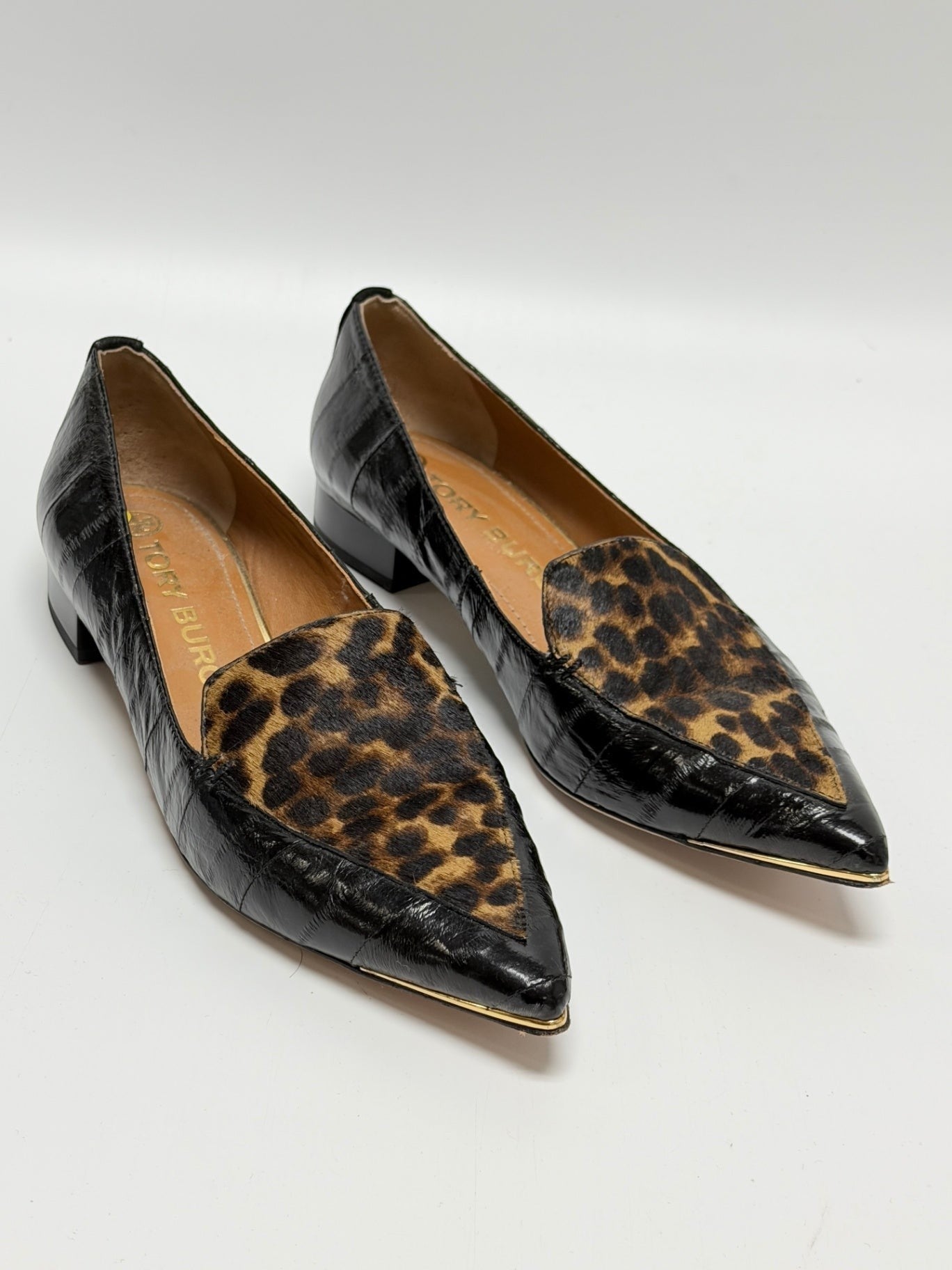 Lynn's Closet Boutique Tory Burch pointed-toe loafers in black croc-embossed leather with leopard print and gold trim.