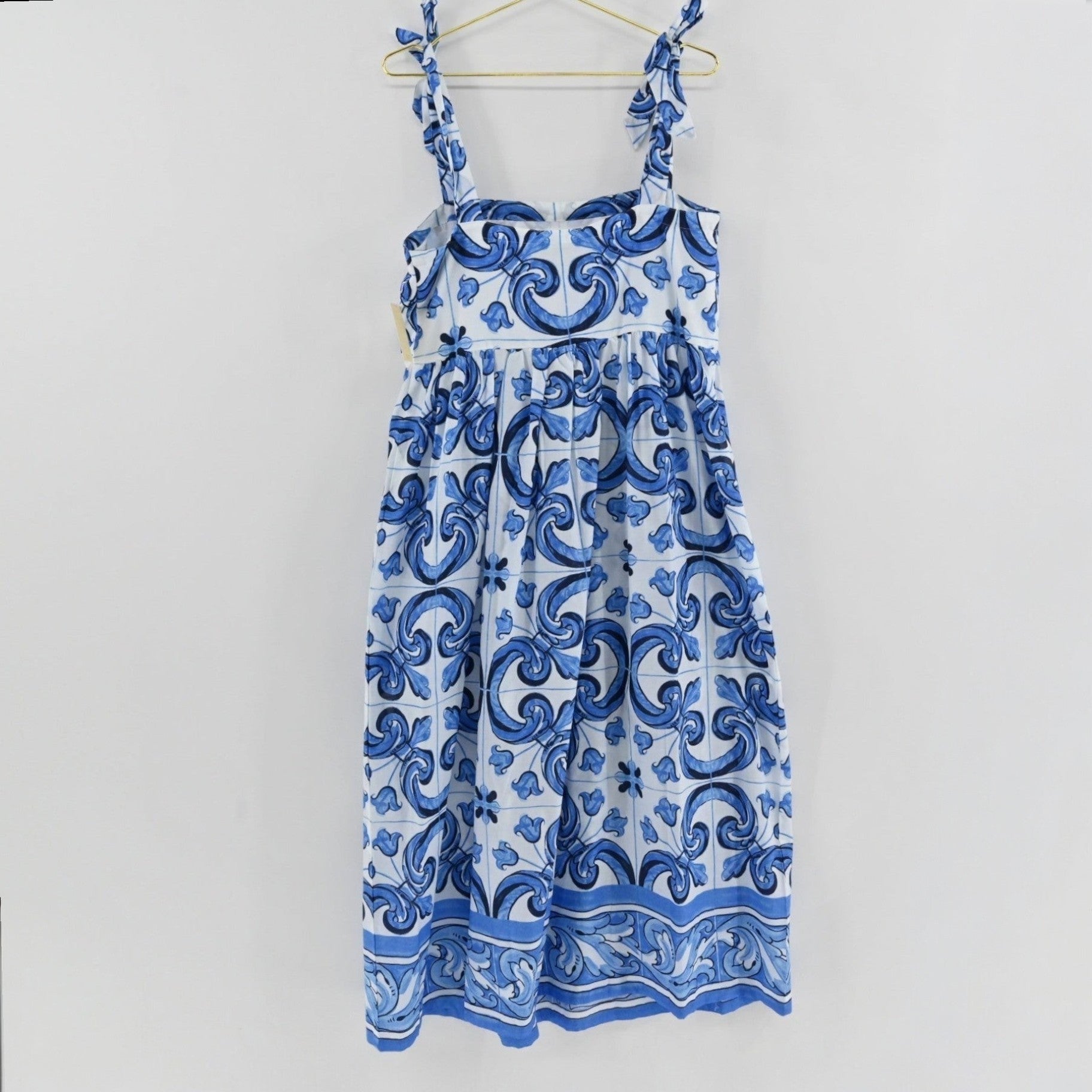 Lynn's Closet Boutique Tuckernuck blue and white tile print midi caftan dress with tie-shoulder straps.