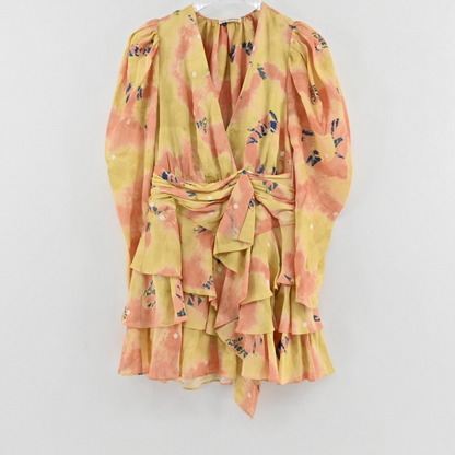 Lynn's Closet Boutique Ulla Johnson yellow and coral floral wrap mini dress with long sleeves and tiered ruffle skirt.