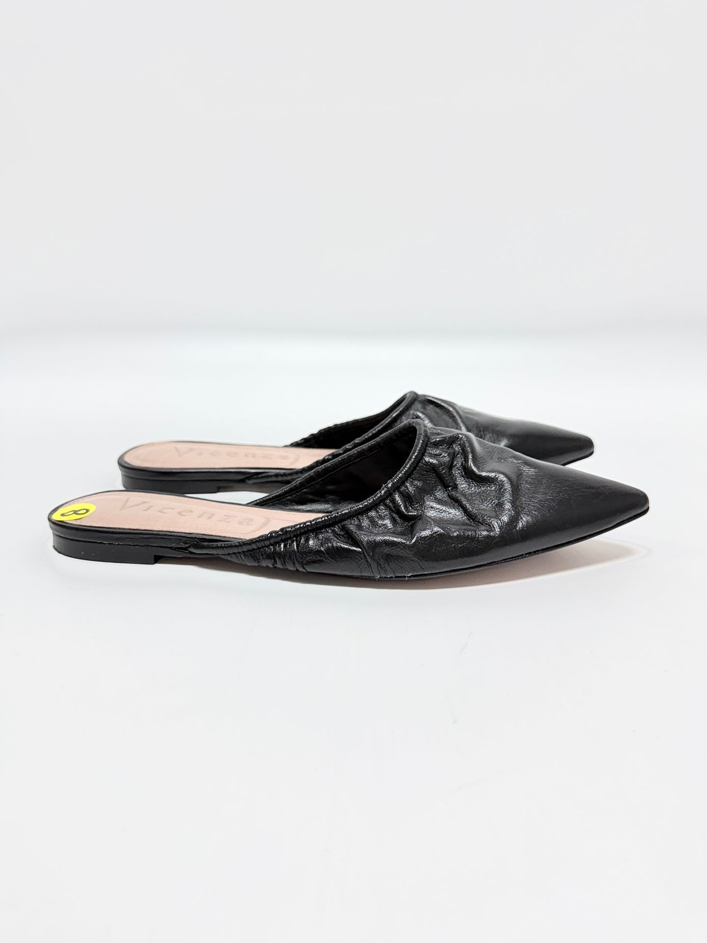 Lynn's Closet Boutique Vicenza black leather mules with ruched texture and pointed-toe design.