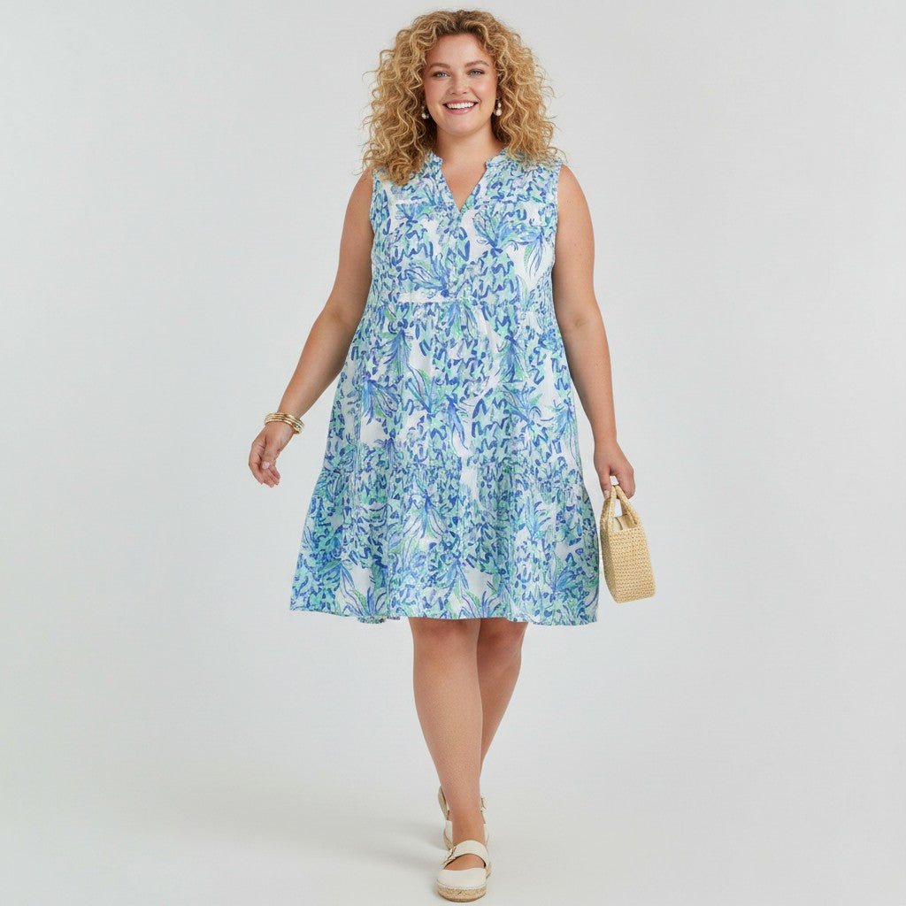 Model wearing a Lynn's Closet Boutique Vilagallo sleeveless tiered dress with a blue and white abstract print.