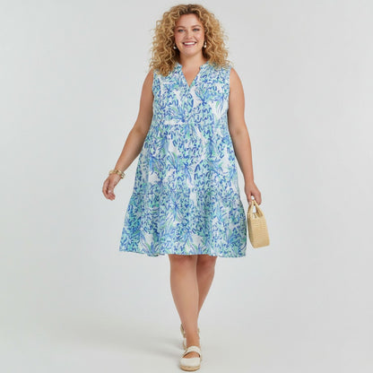 Model wearing a Lynn's Closet Boutique Vilagallo sleeveless tiered dress with a blue and white abstract print.