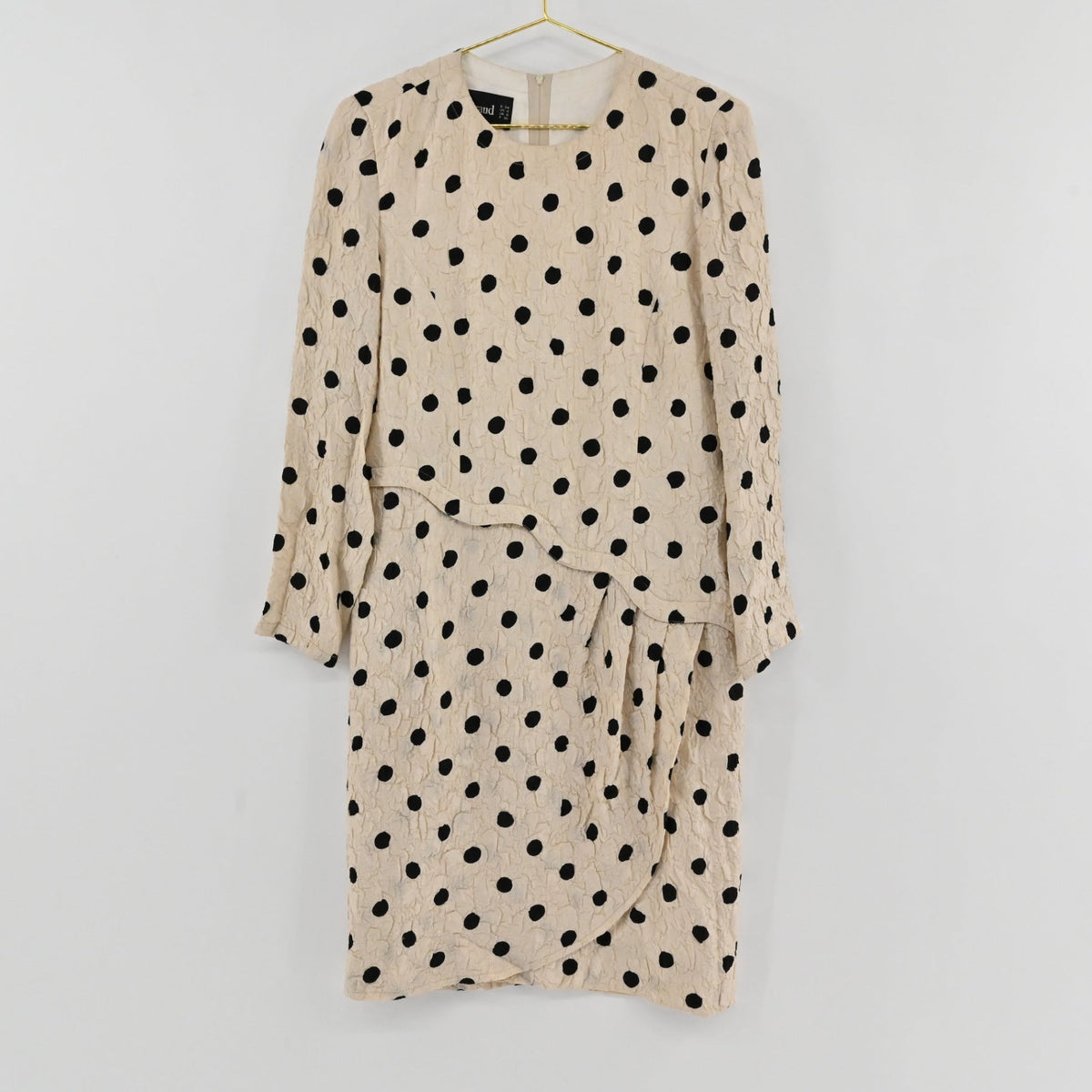 Lynn's Closet Boutique vintage Louis Feraud cream dress with black polka dots, textured fabric, and drop-waist detail.